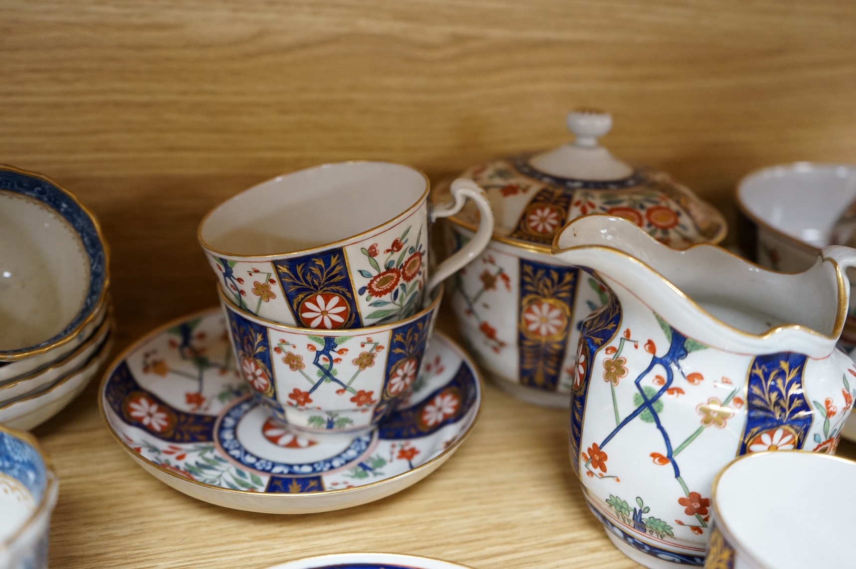 A group of late 18th century Worcester kakiemon pattern tea and coffee wares together with Worcester and Caughley Willow type pattern blue and white coffee ware